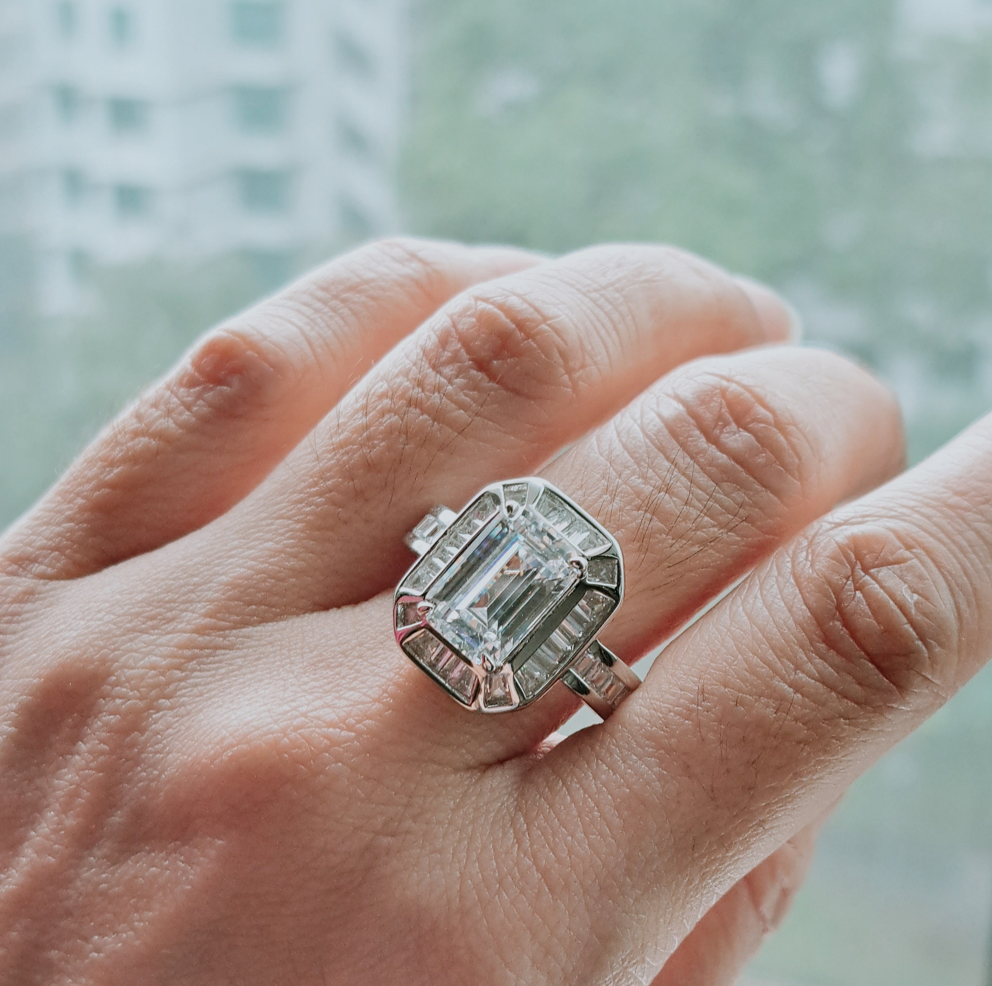 Elegant Emerald cut Scintilli Ring