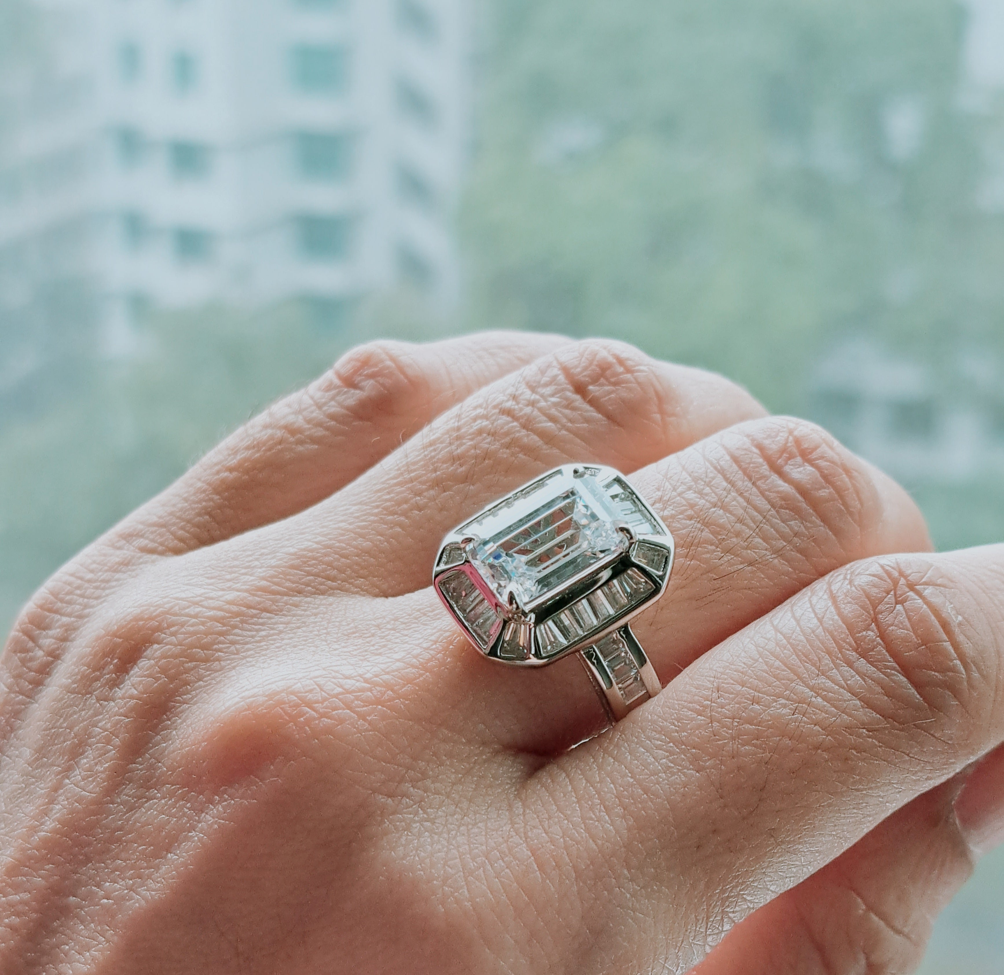 Elegant Emerald cut Scintilli Ring